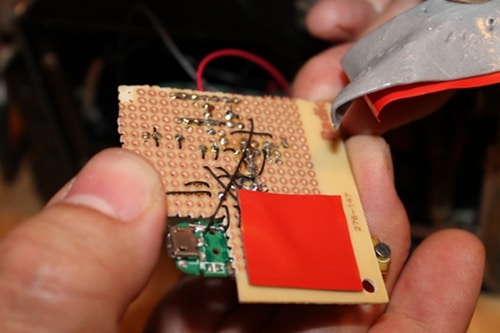 Vintage covering the wires with double stick tape to protect them.