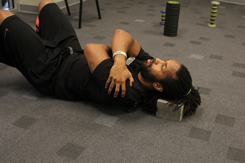 Vintage man laying back hug on the ground.