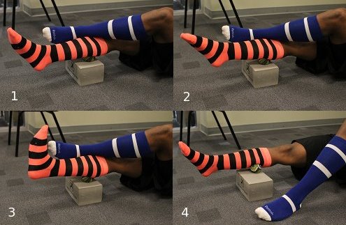 Using lacrosse ball to massage calf muscles.