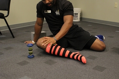 Using roller to apply pressure on balls ide calf.