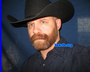 man with beard and cowboy hat grow facial hair