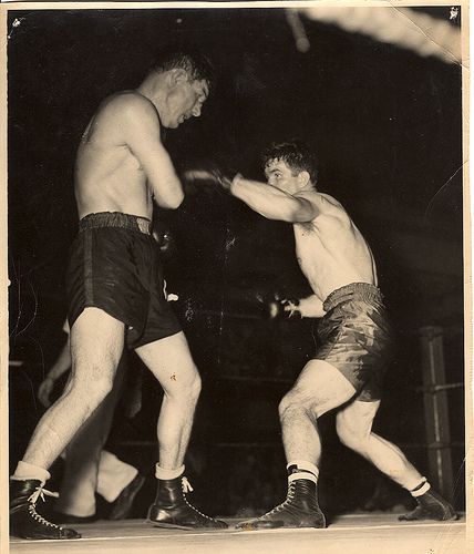 vintage boxing Vintage boxers fighting in the ring.
