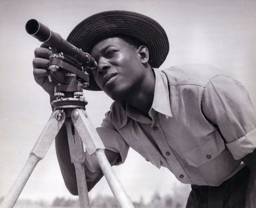 Vintage man surveying the land using triangulation.