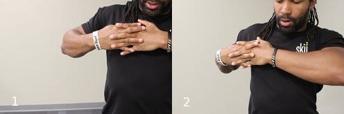 Vintage placing ball on pec and press down with both hands.