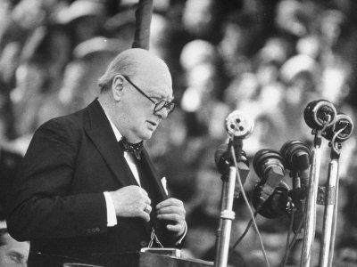 churchill Winston Churchill giving speech glasses suit microphones.
