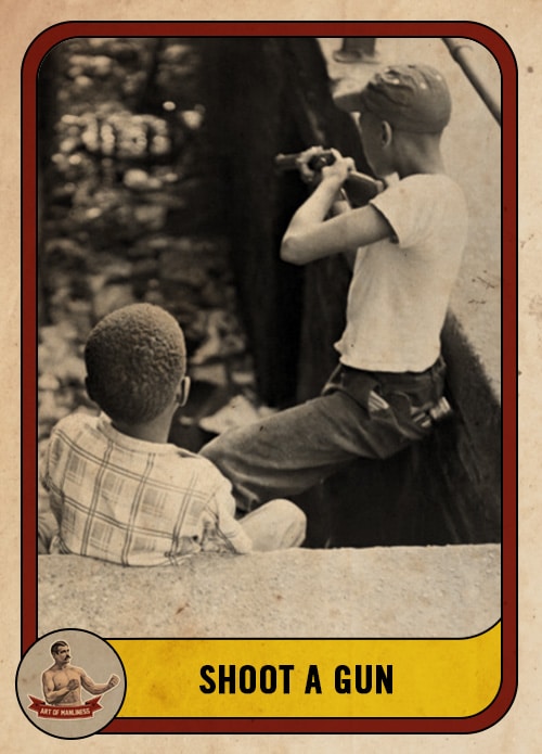 Vintage boys shooting a rifle.