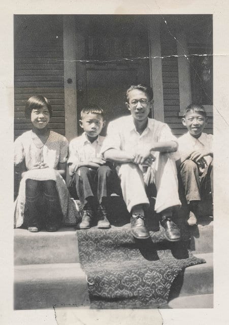 Vintage asian father with children.