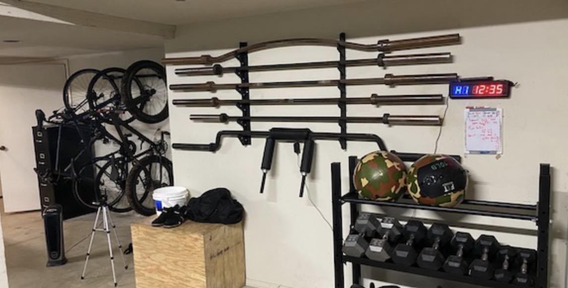 A garage with a bike rack for organizing equipment.