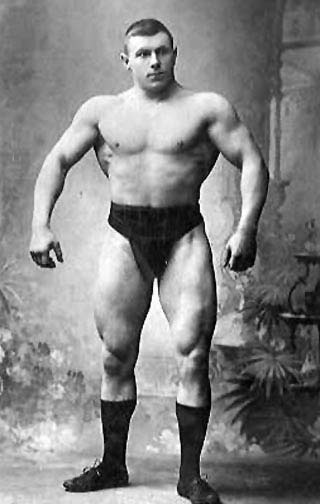 George Hackenschmidt Vintage George Hackenschmidt giving pose and showing body muscles.