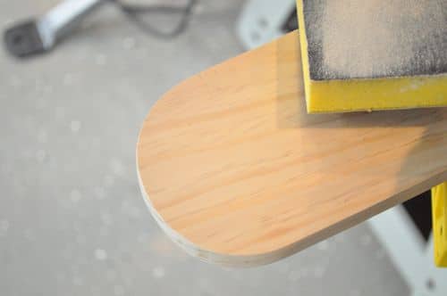 DIY wooden cribbage board cut into semicircle using palm router. 