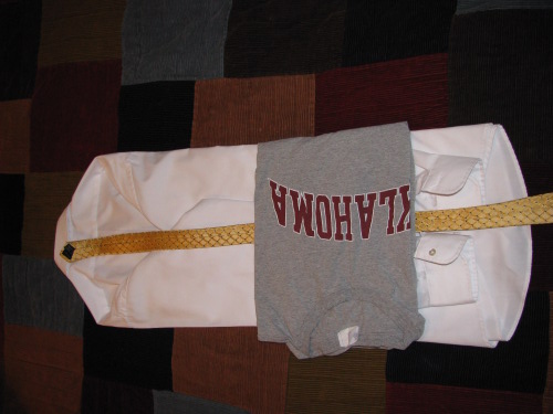 img_0673 Folding clothes into men's dress shirt.