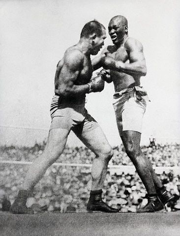 Jack Johnson and James J. Jeffries Vintage Jack Johnson fighting with J Jeffries in boxing match.