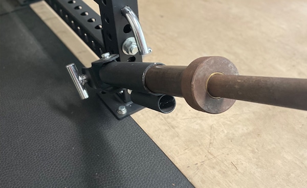 A squat rack with a bar suitable for strength training exercises.