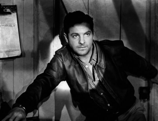 vintage man wearing leather jacket being in spotlight.