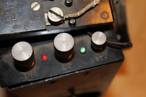 Vintage some red and green panel led's to the top of the field phone.