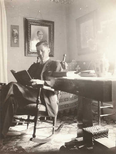 vintage reading Vintage man reading in chair late 1800s early 1900s.
