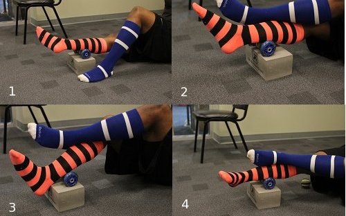 Using roller to apply pressure on calf muscles.