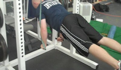 strap-pushups Man doing ring push up bodyweight workout.