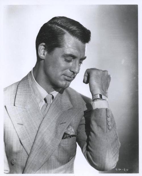 Vintage businessman in suit wearing dress watch wristwatch.