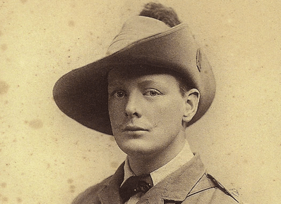 A man wearing a hat, channeling his inner Winston Churchill.