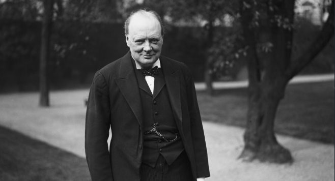 A black and white photo of a man in a suit, reminiscent of Winston Churchill.