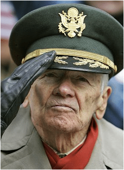 An older man in a military uniform, embodying the spirit of the greatest generation as he salutes with utmost manliness.