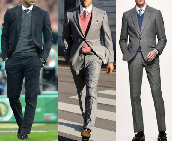 Mean wearing V-neck sweaters with suits.